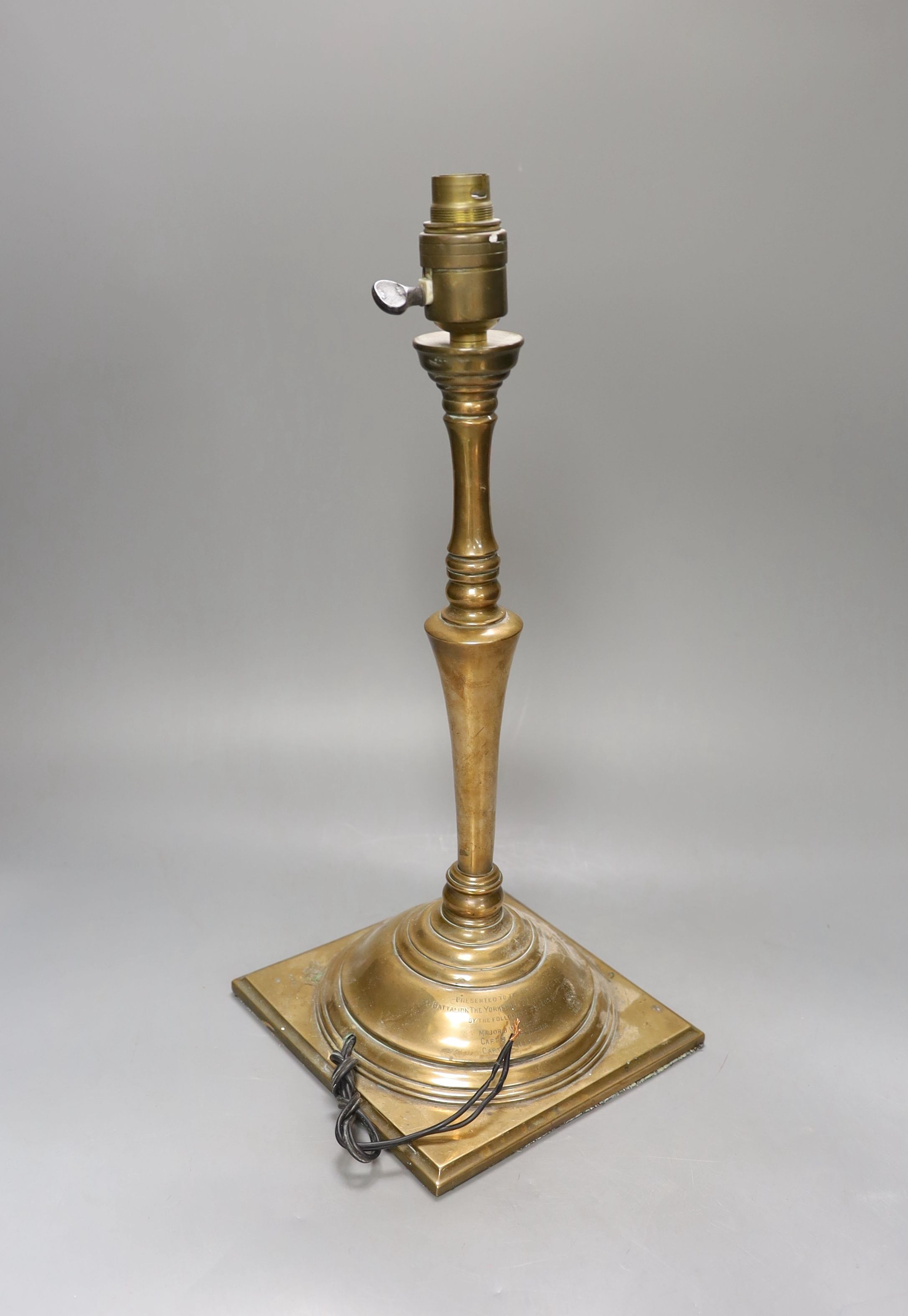 A late Victorian copper alloy table lamp, engraved inscription ‘presented to the officers mess of the 3rd battalion of the Yorkshire regiment (the princess of Wales’ own) by the following officers on promotion Major J.W